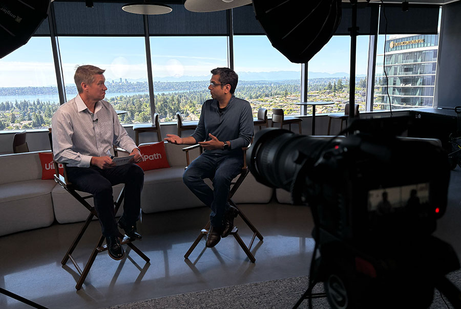 GeekWire cofounder John Cook and UiPath's Taqi Jaffri