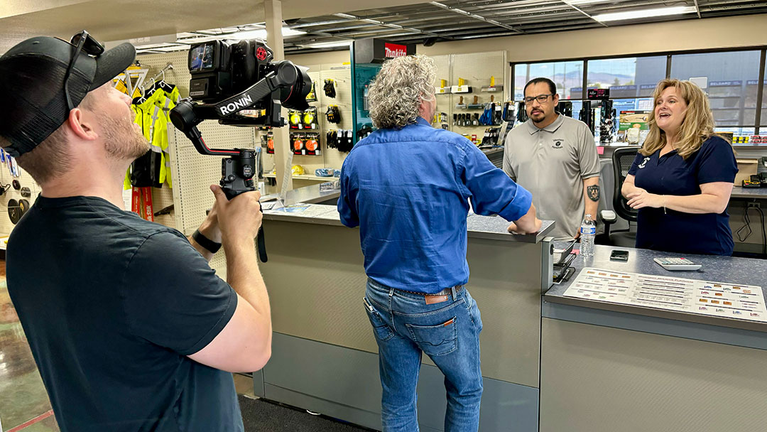 Videographer captures meeting between business owner and employees